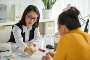 Two ladies discussing relating to foreign maid insurance in Malaysia